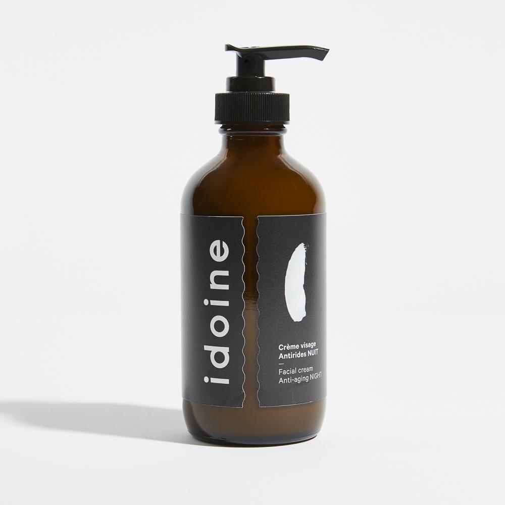 Idoine organic anti-aging night cream in large amber pump bottle, natural facial moisturizer for hydration and skin renewal